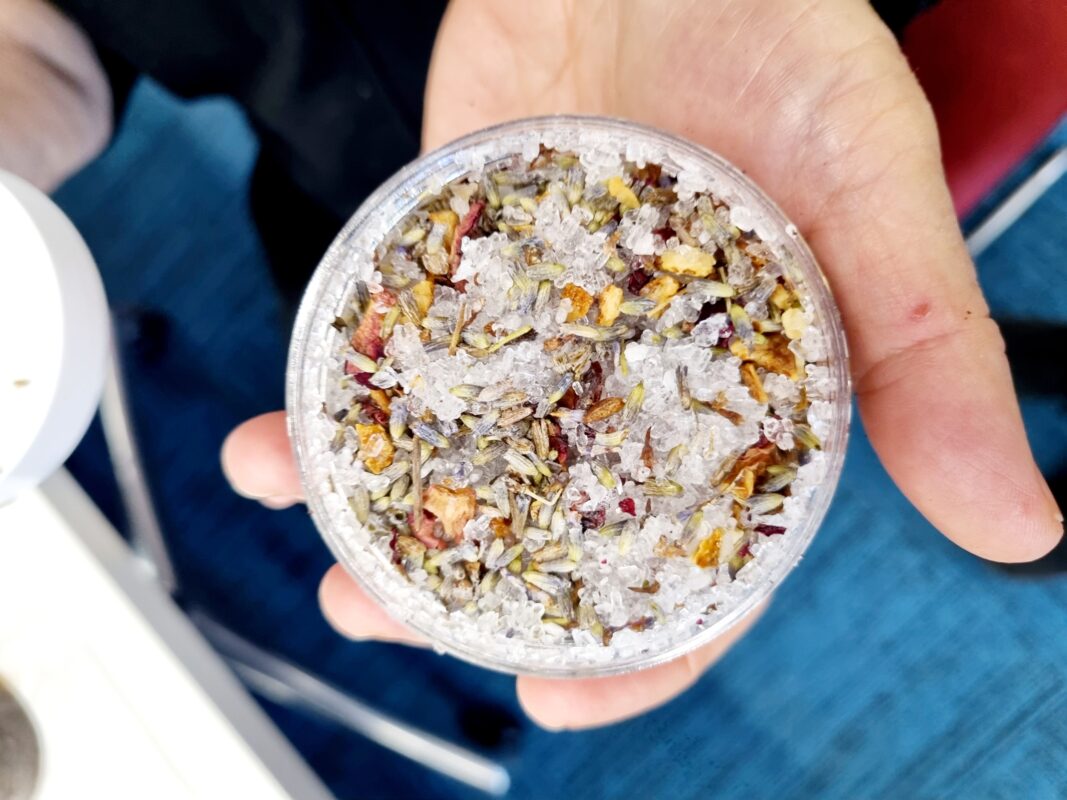 Wedding guest activities at a DIY bath salt station with essential oils and dried flowers at a wedding in Australia